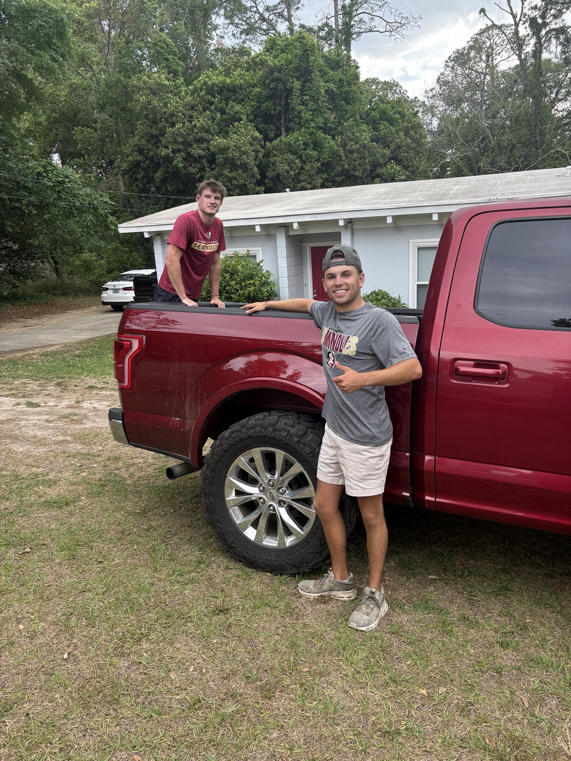 R&B Junk Removal team beside their truck